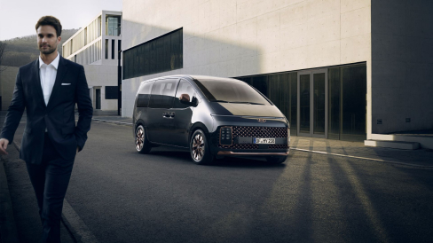Left-front side-view of the all-new staria on the road.