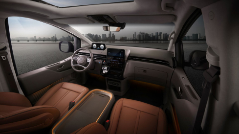 The new i30 Hatchback driving towards a bridge.